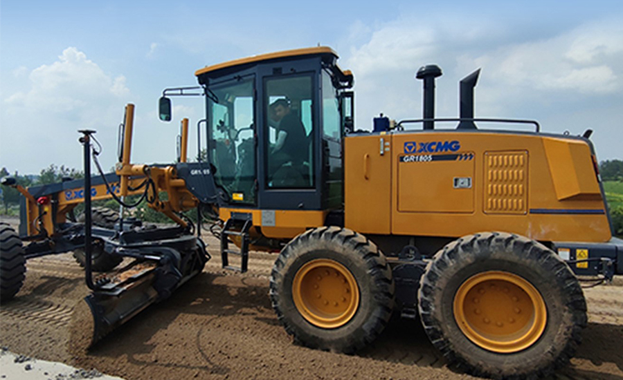 Man operating a tractor with advanced Machine Control technology in agricultural field