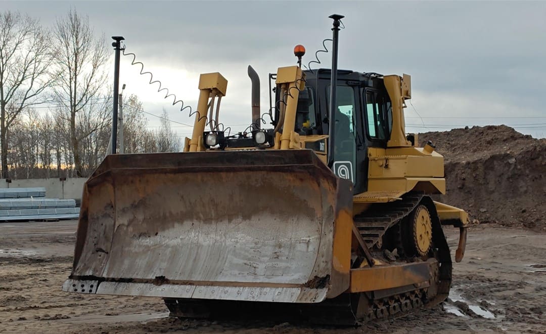 bulldozer performing precision grading with GPS machine control on construction site